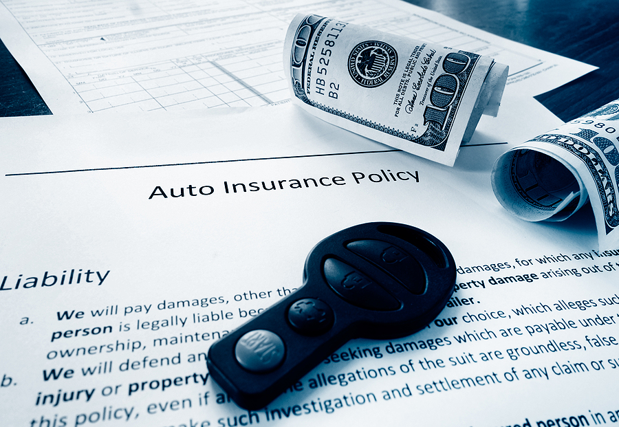Auto insurance policy with cash and car key
