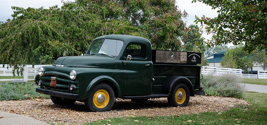 Green Commercial Pickup Truck on Lawn