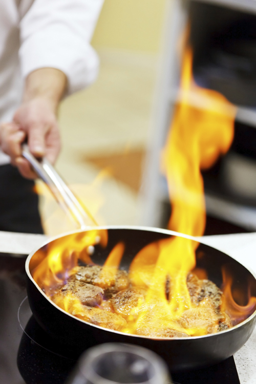 Chef Preparing a Meal in a Kitchen