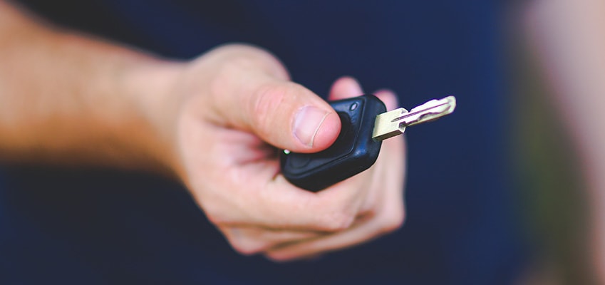 man with key in hand